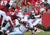 Arkansas defensive back Tevin Mitchel pulls down Jacksonville State running back DaMarcus James on Saturday night. 
