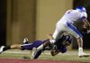 Jake Hornibrook, a Fayetteville defensive back, wraps up Memphis University School running back Shane Tucker during Thursday’s game at Reynolds Razorback Stadium in Fayetteville.