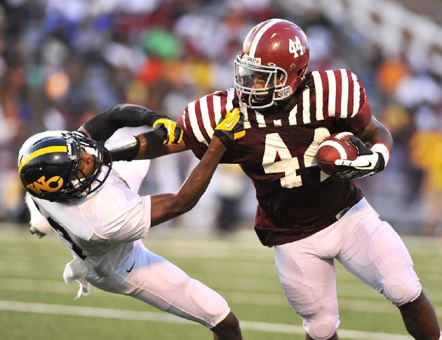 pine-bluff-fullback-kelvin-sergeant-right-stiff-arms-watson-chapel-cornerback-jordan-stargell-during-the-first-quarter-of-friday-nights-game-the-zebras-scored-48-first-half-points-en-route-to-a-48-12-victory