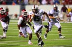 Louisiana-Monroe quarterback Kolton Browning outruns Arkansas linebacker Alonzo Highsmith (45) to the end zone for an overtime touchdown and a 34-31 victory over the No. 8 Razorbacks on Saturday at War Memorial Stadium in Little Rock. The Warhawks trailed 28-7 in the third quarter before the comeback.