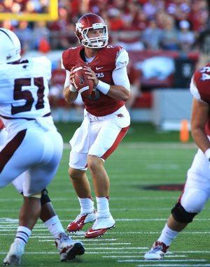 Arkansas quarterback Tyler Wilson suffered what the team described as “an injury above the shoulders” late in the first half. Coach John L. Smith did not offer a more detailed injury report after the game. 