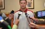 Arkansas quarterback Tyler Wilson (shown at an earlier news conference) was still feeling groggy with symptoms from his shot to the helmet after his return to campus Sunday, Coach John L. Smith said.