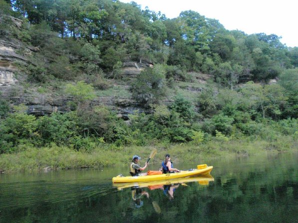 
                           Jen Hazelrigs, the center's director, left, and Kyrie Leaf paddle past bluffs on the White River below Beaver Dam.   