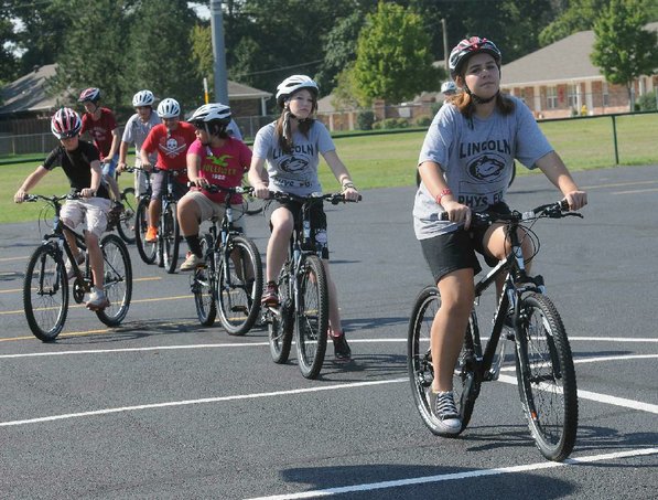Students practice shifting and braking.