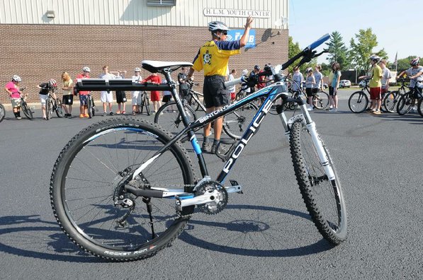 Lt. Joe Falcon with the Bentonville Police Department starts Thursday's bicycle training sesssion at Lincoln Junior High School. Falcon is part of the department's bike patrol.