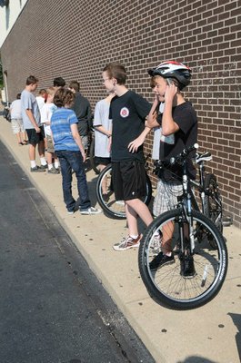 Lincoln Junior High students don helmets and select bicycles for Thursday's instruction.