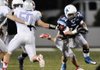 STAFF PHOTO SAMANTHA BAKER -- Springdale Har-Ber High School's Tucker Lee, right, gets around Will Bragg of Fort Smith Soutside High School while making a run downfield Friday, Sept. 14, 2012, at Bulldog Stadium in Springdale.