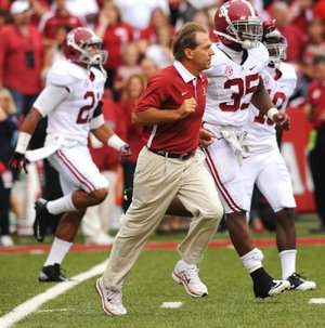 Arkansas hasn’t had much luck against Alabama Coach Nick Saban (center), losing its last six games since Saban took over, or against No. 1 ranked teams, finishing 4-15. 
