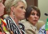 State Treasurer Martha Shoffner, right, listens to Autumn Sanson, her chief investment officer, tell her side of the story at a meeting of the Legislative Joint Auditing Committee on September 17, 2012.