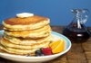 Classic Buttermilk Pancakes, stacked mile-high and dripping with syrup, make a delicious breakfast or dinner. 