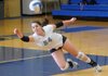 Anna Hudgeons of Springdale Har-Ber dives for the ball Tuesday during the first set against Rogers High at King Arena in Rogers.