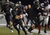 Chris Mizelle, a Bentonville cornerback, returns an interception 39 yards during the second quarter of the Tigers’ game Friday against South Panola (Miss.) at Tiger Stadium in Bentonville.