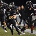 Chris Mizelle, a Bentonville cornerback, returns an interception 39 yards during the second quarter ...