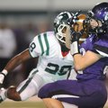 Cole Harris, right, a Fayetteville senior receiver, pulls down a 60-yard pass behind Muskogee (Okla....