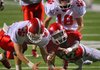 Jacksonville’s Aaron Smith (right), shown against Cabot in the Red Devils’ season-opening game, ran 30 times for 185 yards and 1 touchdown last week.