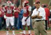 STAFF PHOTO BY MICHAEL WOODS --09/15/2012-- University of Arkansas coach John L Smith watches the team warm up before the start of Saturday afternoons game against Alabama at Razorback Stadium in Fayetteville.