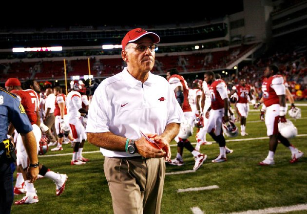 staff-photo-jason-ivester-arkansas-head-coach-john-l-smith-walks-off-the-field-following-the-razorbacks-35-26-loss-to-rutgers-on-saturday-sept-22-2012-at-donald-w-reynolds-razorback-stadium-in-fayetteville
