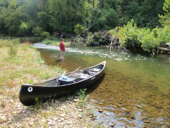 
                           Alan Bland of Rogers cools his feet while wade-fishing a stretch of the War Eagle River on Friday, the last day of summer.    