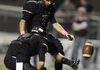 Bentonville kicker Dillon Wade kicks an extra point as teamate Trey Perkins holds during the Tigers' game Friday, Sept. 28, 2012, against Siloam Springs at Tiger Stadium in Bentonville.