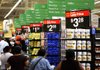 Customers shop during the grand opening of a Wal-Mart Stores Inc. location in Panorama City, California, U.S., on Friday, Sept. 28, 2012. Wal-Mart Stores Inc., the worlds largest retailer, will hire more than 50,000 temporary workers in its U.S. stores for the holiday shopping season. Photographer: Patrick T. Fallon/Bloomberg