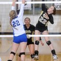 MacKenzie Muirhead, left, of Rogers High tries to block a kill by Bentonville's Anna LeDuc on Tuesda...