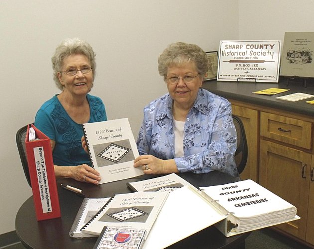 eva-royal-left-secretary-of-the-sharp-county-historical-society-accepts-a-book-with-sharp-county-genelogical-information-from-joayce-hambleton-whitten-for-the-society