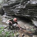 Mike Slay with The Nature Conservancy explores an area where a spring flows from a low bluff on the ...