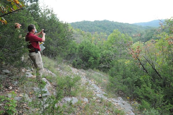 
                           Mike Slay, from left, Chris Colclasure and Theo Witsell take in the view from a glade.