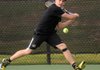 Justin Pollard of Bentonville runs down the ball Monday at Memorial Park in Bentonville during a match against Rogers High School.