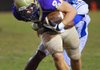 Arkadelphia’s Jahlon Mitchell (right) wraps up Central Arkansas Christian’s Chase Dowell during the first half Friday in North Little Rock. 