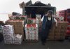 A seller looks at boxes of tomatoes at the Central de Abasto, Mexico City’s main wholesale produce market, in the borough of Iztapalapa in April. A group of U.S. tomato growers are complaining that Mexico growers are unfairly exporting low-cost tomatoes north of the border. 