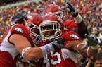 Arkansas middle linebacker Alonzo Highsmith (45) won’t get a chance to celebrate like he did last season when he returned a fumble for a touchdown against LSU. Highsmith, a senior, was scheduled to undergo surgery Monday because of a foot injury and will miss the rest of the season. 
