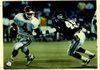Former Arkansas quarterback Quinn Grovey (4) tries to avoide TCU’s Edward Galariz during the Razorbacks’ 41-19 victory in 1989, part of a 10-2 season for Arkansas in which it won the Southwest Conference championship. The following season, Grovey and Arkansas finished a disappointing 3-8. 