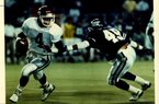 Former Arkansas quarterback Quinn Grovey (4) tries to avoide TCU’s Edward Galariz during the Razorbacks’ 41-19 victory in 1989, part of a 10-2 season for Arkansas in which it won the Southwest Conference championship. The following season, Grovey and Arkansas finished a disappointing 3-8. 