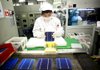 An employee at Suntech Power Holdings Co.’s factory in Wuxi, China, assembles photovoltaic cells. Chinese solar-panel manufacturers are protesting stiff tariffs the U.S. Commerce Department upheld Wednesday. 