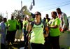 Kasi Farrar of San Francisco leads more than 100 people gathered Wednesday outside the Wal-Mart home office in Bentonville to protest working conditions at the retailer’s facilities. 