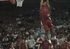 University of Arkansas basketball freshman Michael Qualls flies in the air during a dunking contest at Bud Walton Arena, Friday Oct. 12, 2012, as team mates look on during the Primetime at the Palace. 