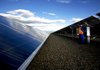 A foreman with Cupertino Electric Inc. performs a voltage output test on a section of solar panels at the Southern California Edison solar array in Porterville, Calif. The federal government on Friday said it is establishing 17 new “solar energy zones” in six states. 