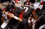 NWA Media/JASON IVESTER -- Arkansas quarterback Tyler Wilson rolls out of the pocket to pass against Kentucky during the second quarter on Saturday, Oct. 13, 2012, at Donald W. Reynolds Razorback Stadium in Fayetteville.
