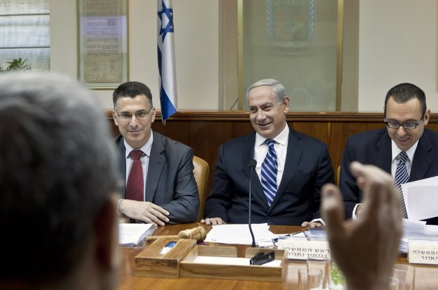 israeli-prime-minister-benjamin-netanyahu-second-right-laughs-as-defense-minister-ehud-barak-back-to-camera-makes-a-joke-that-netanyahu-should-give-fair-time-to-the-opposition-in-political-statements-as-netanyahu-chairs-the-weekly-cabinet-meeting-in-his-jerusalem-offices-sunday-oct-14-2012-israels-cabinet-announced-january-22-2013-as-the-date-for-parliamentary-elections-with-prime-minister-benjamin-netanyahu-leading-in-the-polls