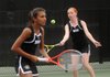 Kruti Shah, left, waits as her doubles tennis partner Mallory Tabler, both of Bentonville High School, hits the ball Tuesday at the Fayetteville Tennis Complex off North Lewis Avenue in Fayetteville. Tuesday was the second and final day of the 7A/6A West Conference Tennis Tournament. Players from Bentonville, Rogers, Rogers Heritage, Springdale Har-Ber, Fayetteville, Bryant and Van Buren competed.