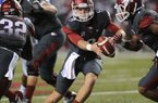 The Razorbacks will have to help their tackles to protect quarterback Tyler Wilson (shown) and the passing game against the LSU Tigers’ talented pass rushers.