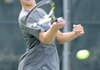 Reed Churchill of Fayetteville returns a volley Tuesday during the Class 7A state tennis finals held at Burns Park in North Little Rock.