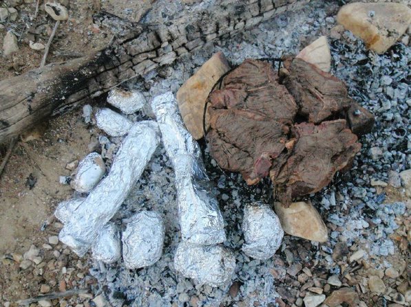 A feast fit for kings on the Kings. Moose steaks sizzle on the grill next to mushrooms and baked potatoes. Mark "Hog Ears" Hughes lives in Alaska and killed a moose on a hunt earlier this year.
