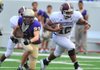 Stuttgart quarterback Dontrell Brown (right) runs through the CAC defense for a first down during the third quarter of Monday night's Kick Off Classic at War Memorial Stadium in Little Rock.
Special to the Democrat-Gazette/JIMMY JONES