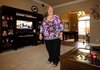 Lori Proud in her favorite personal space, the living room of her Springdale home.