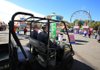 Arkansas State Police Cpls. George Enke (left) and Sequoyah Browning patrol the midway of the Arkansas State Fair in Little Rock on Thursday. 