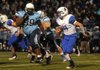 STAFF PHOTO SAMANTHA BAKER -- Brett D'Amico of Rogers High School, right, runs away from Josh Frazier of Springdale Har-Ber High School Friday, Oct. 19, 2012, during homecoming at Jarrell Williams Bulldog Stadium in Springdale. 
