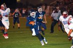 #11 QB Jabe Burgess of Greenwood keeps the ball and picks up a first down.