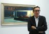 French curator Didier Ottinger poses in front of Nighthawks, as part of the retrospective of Edward Hopper at Paris’ Grand Palais Museum. 